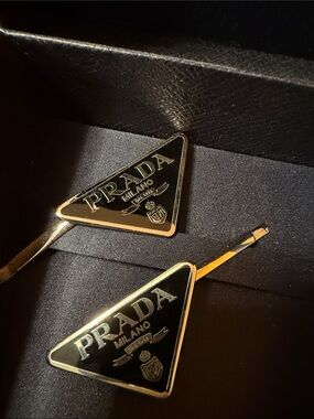 Prada Black and Gold Triangle Logo Hair Clips cozy